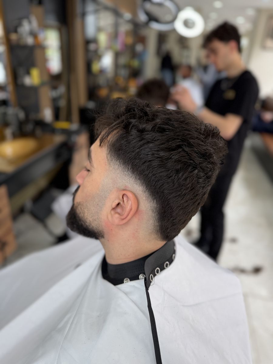Textured top with burst fade and beard at OTB's Barberhouse